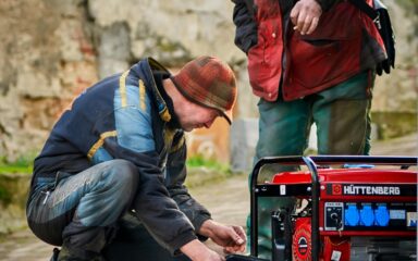 An engineer fixing a generator